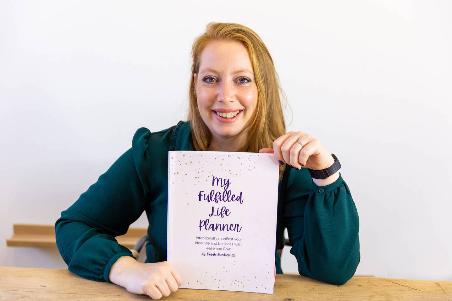 Sarah Sienkiewicz holding My Fulfilled Life Planner